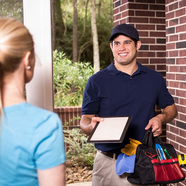Repairman at customer's front door